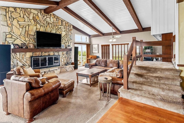142 Vecchio Ln, Morgantown, WV 26508 - carpeted living room featuring beamed ceiling, a stone fireplace, a ceiling fan, high vaulted ceiling, and stairway