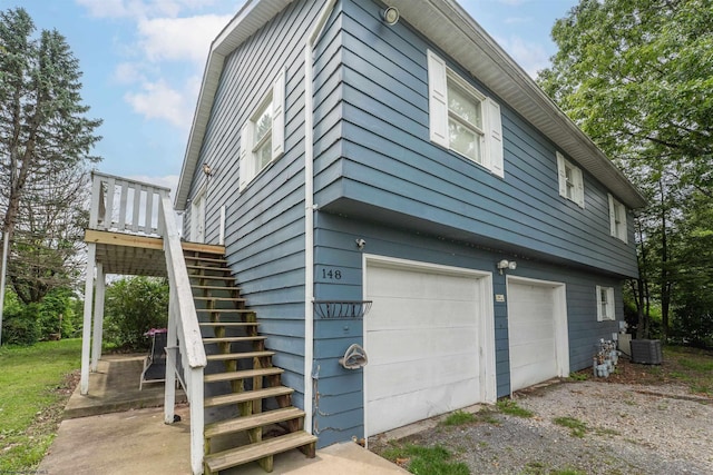 142 Vecchio Ln, Morgantown, WV 26508 - view of home's exterior with an attached garage, stairs, and driveway