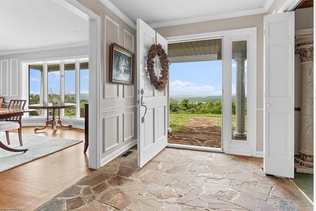 142 Vecchio Ln, Morgantown, WV 26508 - foyer with ornamental molding, healthy amount of natural light, and light stone finish flooring