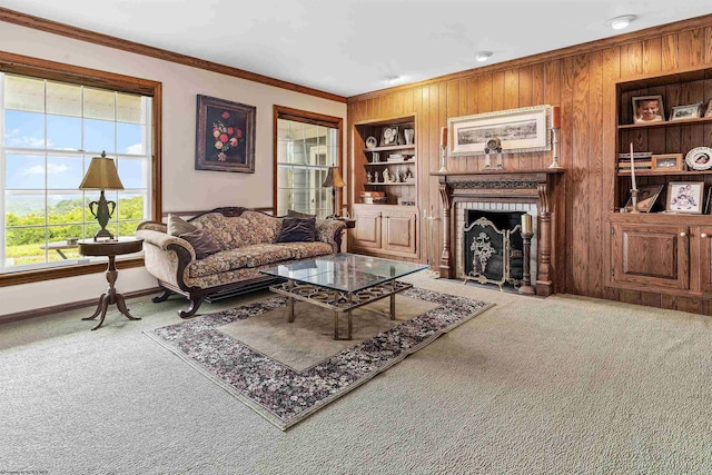 142 Vecchio Ln, Morgantown, WV 26508 - living room featuring carpet floors, built in features, ornamental molding, a brick fireplace, and wood walls