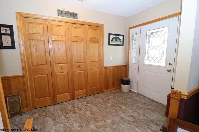 16 Greentree Ln, Elkins, WV 26241 - foyer entrance featuring a wainscoted wall and wooden walls