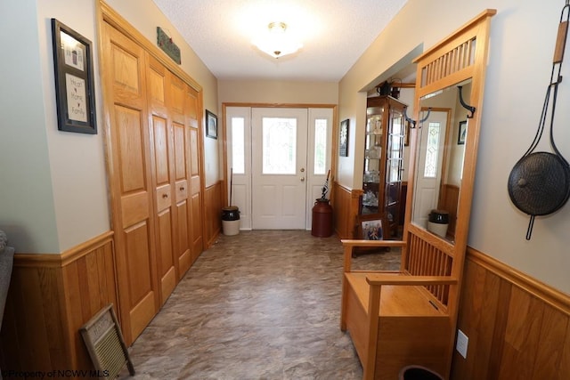 16 Greentree Ln, Elkins, WV 26241 - foyer with a wainscoted wall, plenty of natural light, and wooden walls