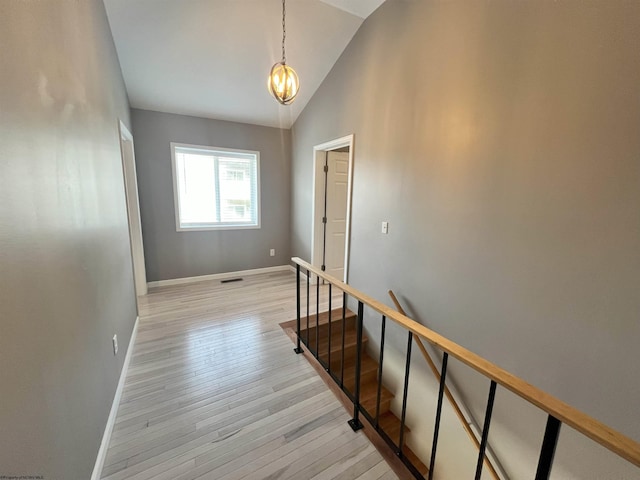 1381 Randall St, Morgantown, WV 26505 - corridor with light wood finished floors, high vaulted ceiling, and a chandelier