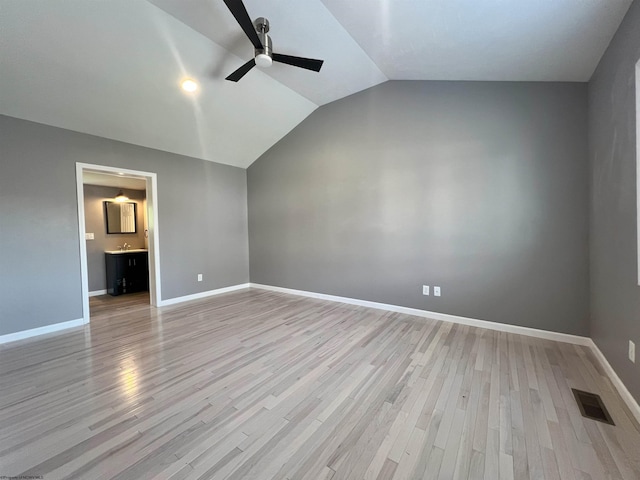 1381 Randall St, Morgantown, WV 26505 - unfurnished bedroom featuring lofted ceiling, light wood-style flooring, ensuite bath, and a ceiling fan