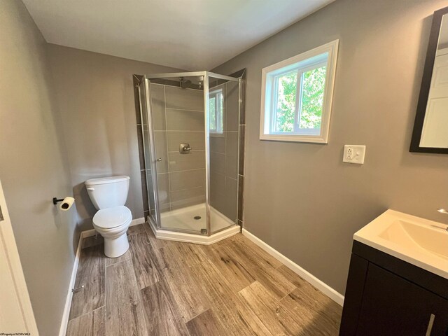1381 Randall St, Morgantown, WV 26505 - bathroom featuring wood finished floors, vanity, and a stall shower