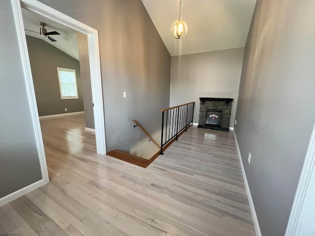 1381 Randall St, Morgantown, WV 26505 - stairway featuring lofted ceiling, wood finished floors, ceiling fan, and a stone fireplace