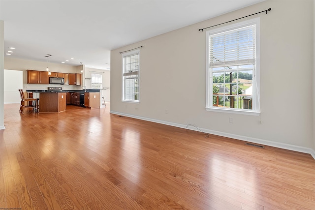 453 Blackberry Ridge Dr, Morgantown, WV 26508 - unfurnished living room with light wood-style flooring and recessed lighting
