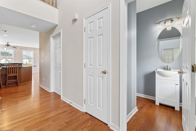 453 Blackberry Ridge Dr, Morgantown, WV 26508 - hall featuring a sink and light wood-style flooring