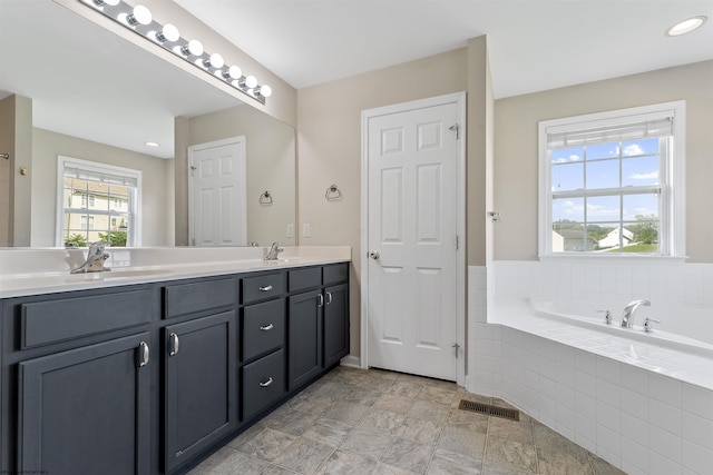 453 Blackberry Ridge Dr, Morgantown, WV 26508 - bathroom with double vanity, a garden tub, and stone finish floors