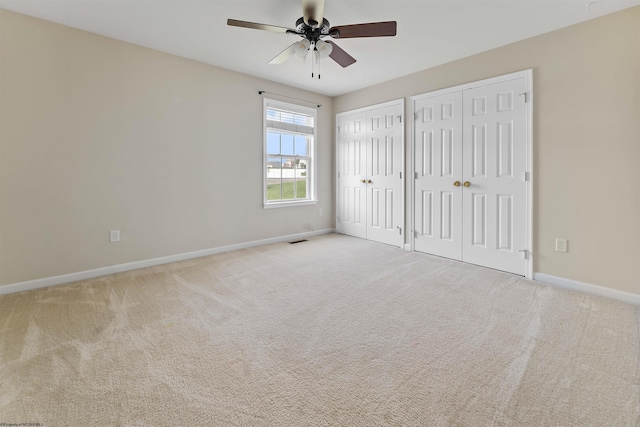 453 Blackberry Ridge Dr, Morgantown, WV 26508 - unfurnished bedroom featuring multiple closets, carpet floors, and ceiling fan