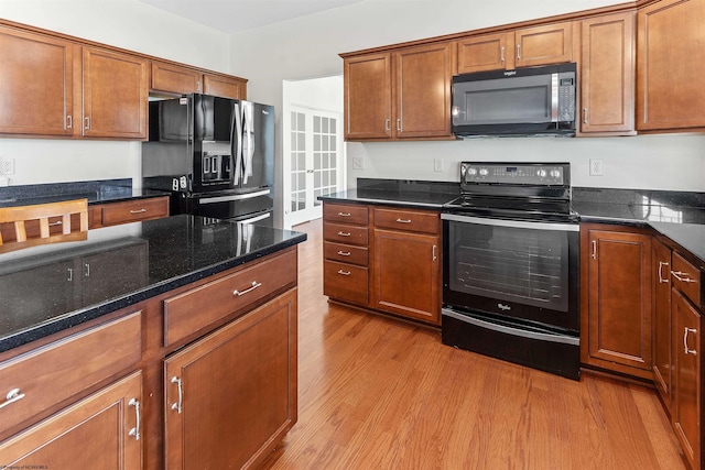 453 Blackberry Ridge Dr, Morgantown, WV 26508 - kitchen featuring black appliances, light wood-style floors, and brown cabinets