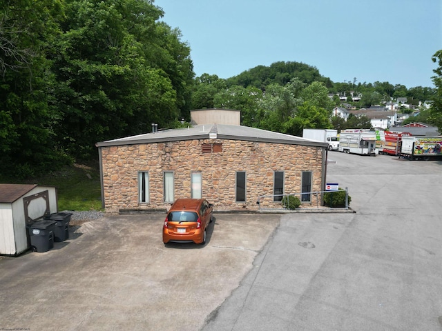 2A Cherry Tree Dr Unit 2, Clarksburg, WV 26301 - view of home's exterior with stone siding and a shed