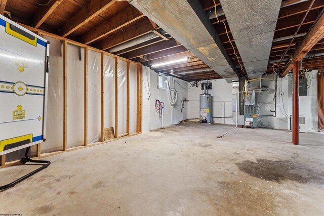 48 Skyline Dr, Morgantown, WV 26508 - unfinished below grade area featuring heating unit, gas water heater, and electric panel