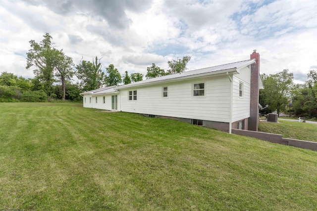 48 Skyline Dr, Morgantown, WV 26508 - back of house with a chimney, a yard, and a metal roof