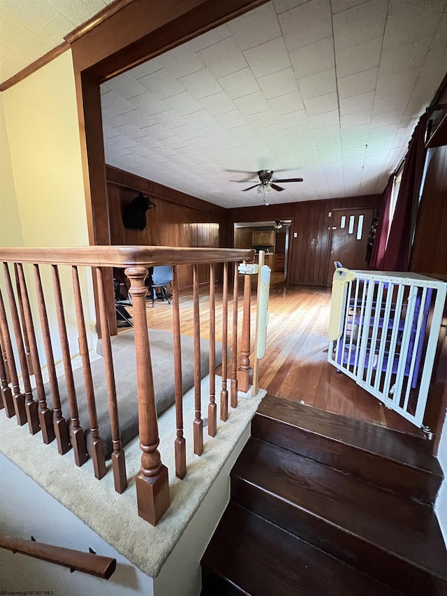 60 Saras Way, Beverly, WV 26253 - stairway with wood finished floors, a ceiling fan, ornamental molding, and wood walls