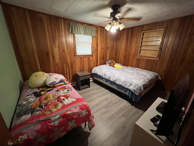 60 Saras Way, Beverly, WV 26253 - bedroom featuring wood walls, light wood-type flooring, and a ceiling fan