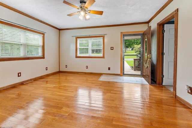 2228 Dinnerbell Five Forks Rd, Farmington, PA 15437 - foyer entrance with ornamental molding, light wood-type flooring, a ceiling fan, and a textured ceiling