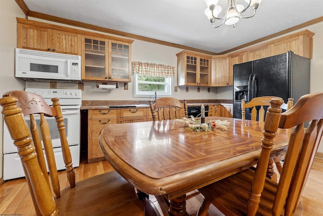 2228 Dinnerbell Five Forks Rd, Farmington, PA 15437 - dining space with a chandelier, light wood-type flooring, ornamental molding, and a textured ceiling