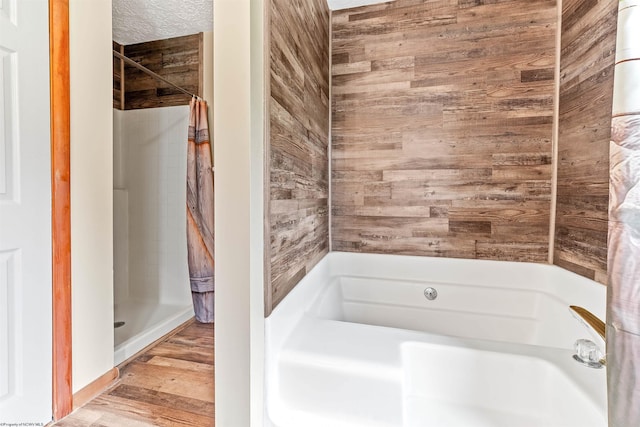 2228 Dinnerbell Five Forks Rd, Farmington, PA 15437 - full bathroom with a shower with curtain, a bath, and wood finished floors