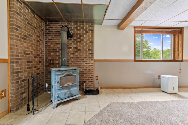 2228 Dinnerbell Five Forks Rd, Farmington, PA 15437 - unfurnished living room with tile patterned floors and a wood stove
