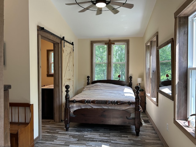 2214 Fairview Rd, Independence, WV 26374 - bedroom featuring vaulted ceiling, wood finished floors, a barn door, and a ceiling fan