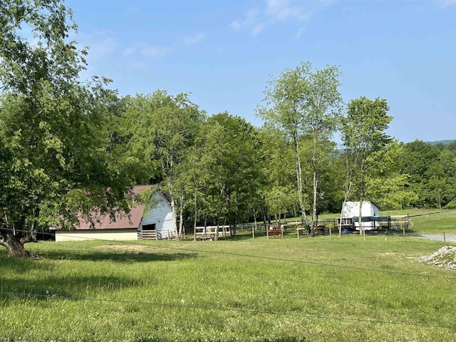 2214 Fairview Rd, Independence, WV 26374 - view of green lawn featuring an outbuilding, a barn, and a wooded view