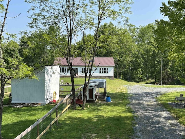 2214 Fairview Rd, Independence, WV 26374 - view of front facade featuring a front yard, a metal roof, and an outbuilding