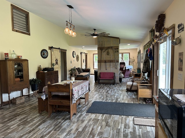 2214 Fairview Rd, Independence, WV 26374 - living area with a barn door, wood finished floors, vaulted ceiling, and ceiling fan