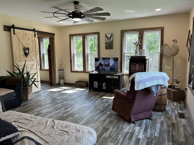 2214 Fairview Rd, Independence, WV 26374 - living room featuring wood finished floors, ceiling fan, plenty of natural light, a barn door, and recessed lighting