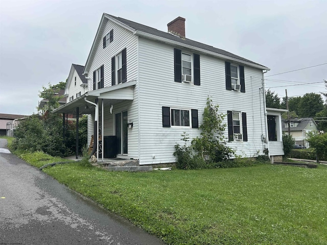 374 Dunkard Ave, Morgantown, WV 26501 - view of front of home featuring a front lawn, a chimney, and cooling unit