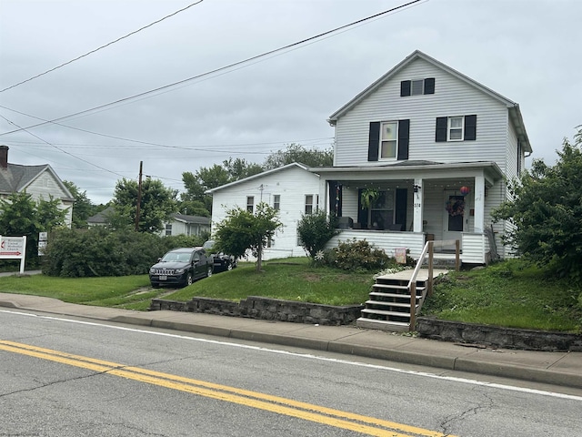 374 Dunkard Ave, Morgantown, WV 26501 - view of front of property with covered porch, a front lawn, and stairway