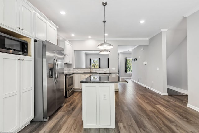 26 Misty Ln, Fairmont, WV 26554 - kitchen featuring stainless steel appliances, crown molding, a kitchen island, dark wood-type flooring, and white cabinets