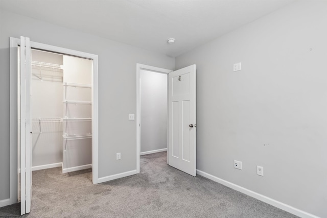 26 Misty Ln, Fairmont, WV 26554 - unfurnished bedroom featuring carpet flooring, a closet, and a walk in closet