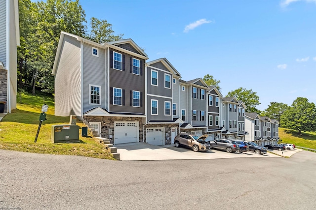 26 Misty Ln, Fairmont, WV 26554 - townhome / multi-family property featuring a residential view, stone siding, an attached garage, driveway, and board and batten siding