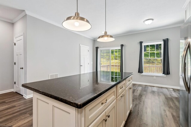 26 Misty Ln, Fairmont, WV 26554 - kitchen with dark wood-type flooring, ornamental molding, decorative light fixtures, freestanding refrigerator, and a center island