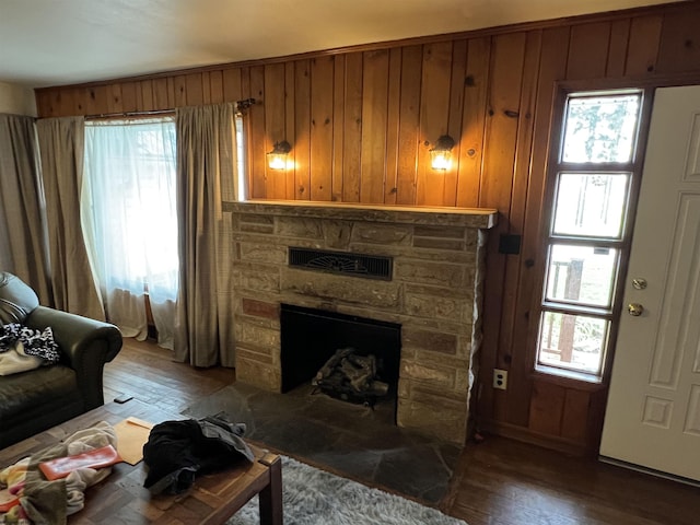 101 Wilson St, Elkins, WV 26241 - living room with a stone fireplace, light wood-type flooring, healthy amount of natural light, and wood walls