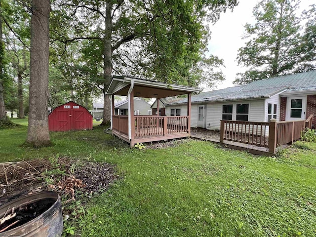 101 Wilson St, Elkins, WV 26241 - view of green lawn with a storage shed and a deck