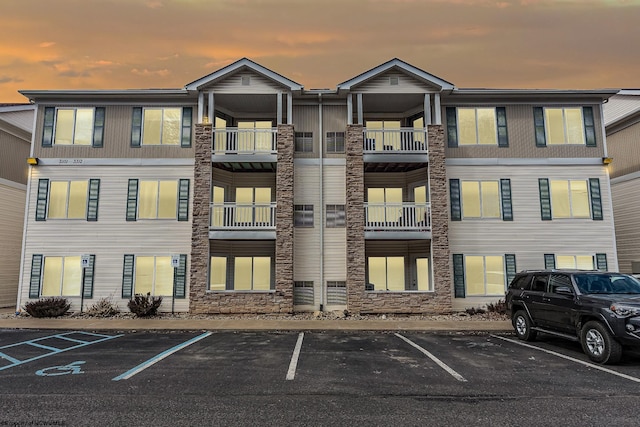 3208 University Commons Dr Unit 2, Star City, WV 26505 - property at dusk featuring uncovered parking
