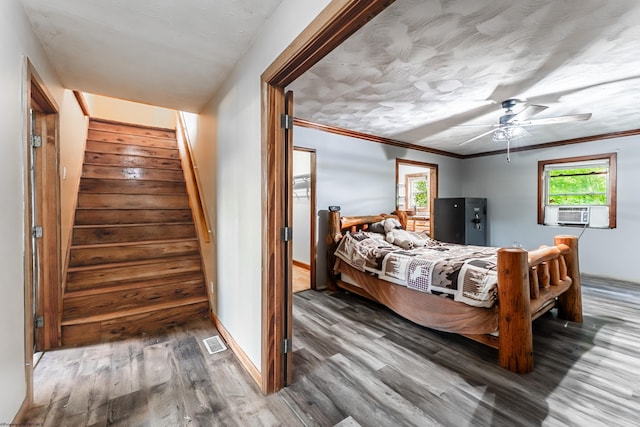 482 Buckeye Rd, Core, WV 26541 - bedroom featuring wood finished floors, multiple windows, cooling unit, ornamental molding, and ceiling fan
