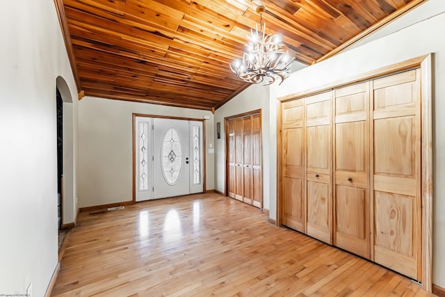 482 Buckeye Rd, Core, WV 26541 - foyer featuring lofted ceiling, arched walkways, a chandelier, wooden ceiling, and light wood-style floors