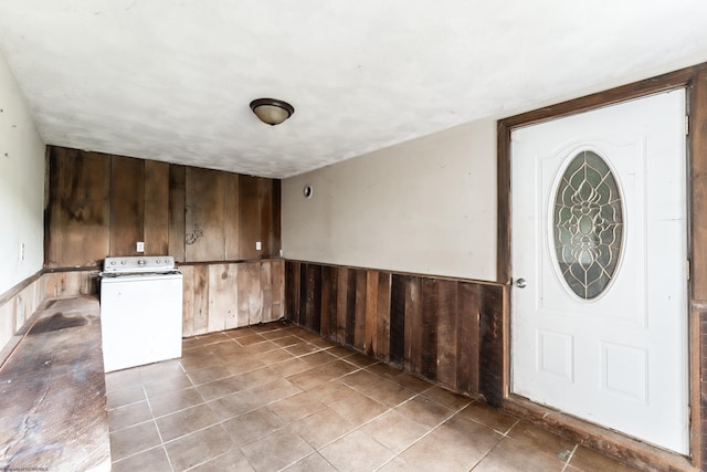 482 Buckeye Rd, Core, WV 26541 - foyer entrance featuring washer / clothes dryer, wooden walls, a wainscoted wall, and tile patterned floors
