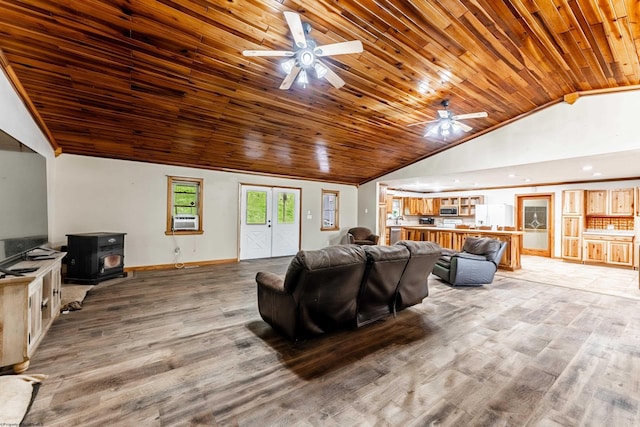 482 Buckeye Rd, Core, WV 26541 - living room with a ceiling fan, a wood stove, light wood-style flooring, wood ceiling, and high vaulted ceiling