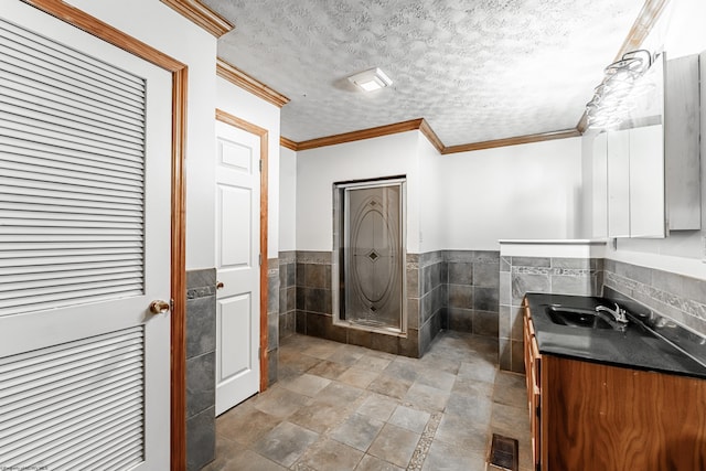 482 Buckeye Rd, Core, WV 26541 - full bath featuring vanity, tile walls, a walk in shower, a textured ceiling, and a wainscoted wall