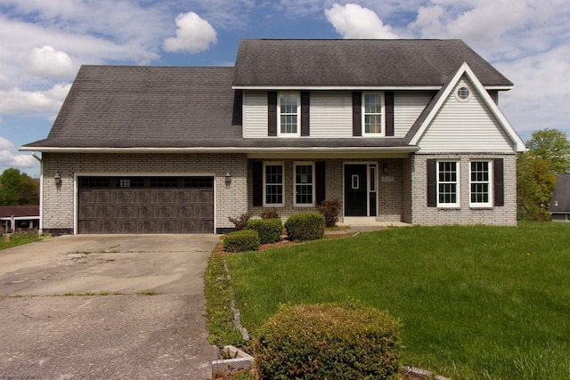 208 Parkview Cir, Kingwood, WV 26537 - view of front facade featuring driveway, a garage, a front yard, and brick siding