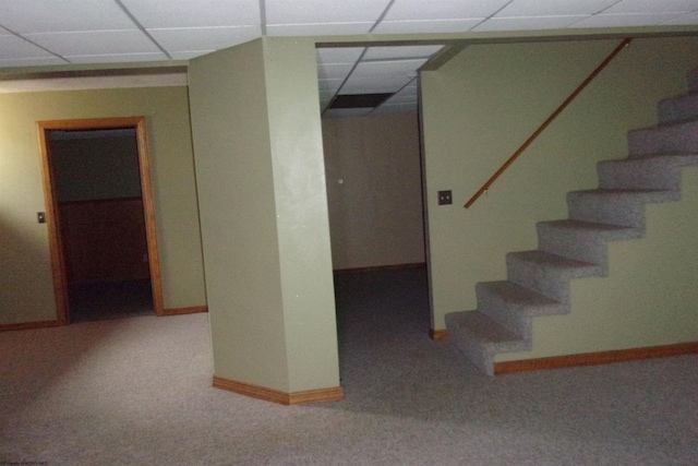 208 Parkview Cir, Kingwood, WV 26537 - finished below grade area with a paneled ceiling, stairway, and carpet flooring