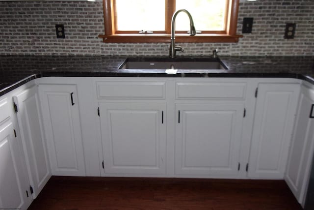 208 Parkview Cir, Kingwood, WV 26537 - kitchen featuring dark countertops, white cabinets, and decorative backsplash