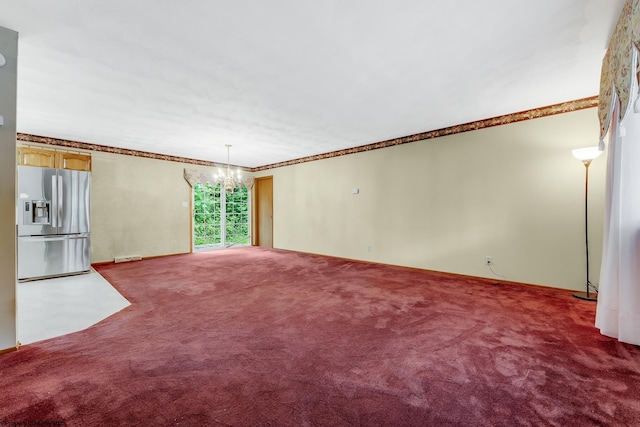 1005 Primrose Ln, Morgantown, WV 26505 - unfurnished living room with carpet floors, a chandelier, and crown molding