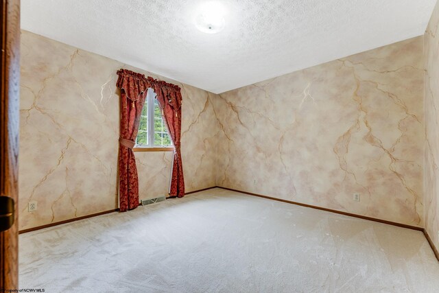 1005 Primrose Ln, Morgantown, WV 26505 - carpeted empty room featuring a textured ceiling