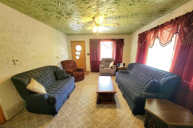 704 S Stewart St, Shinnston, WV 26431 - carpeted living room with a textured wall and ceiling fan