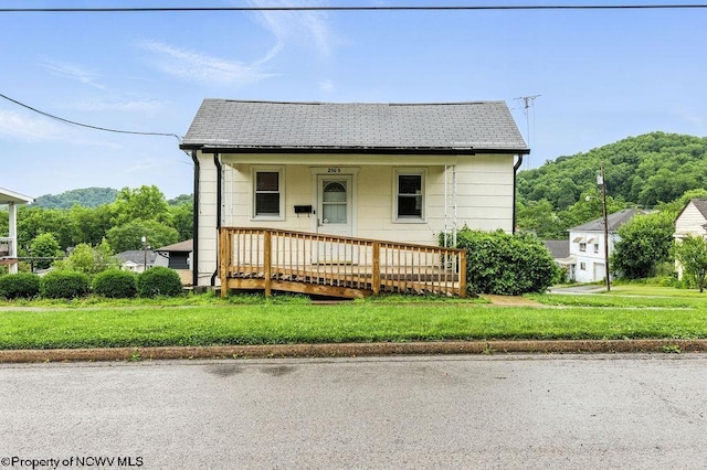 2300 Pride Ave, Clarksburg, WV 26301 - view of front facade featuring a front yard, covered porch, and roof with shingles
